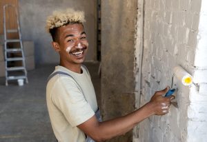 smiley-man-painting-walls-his-new-home (1)